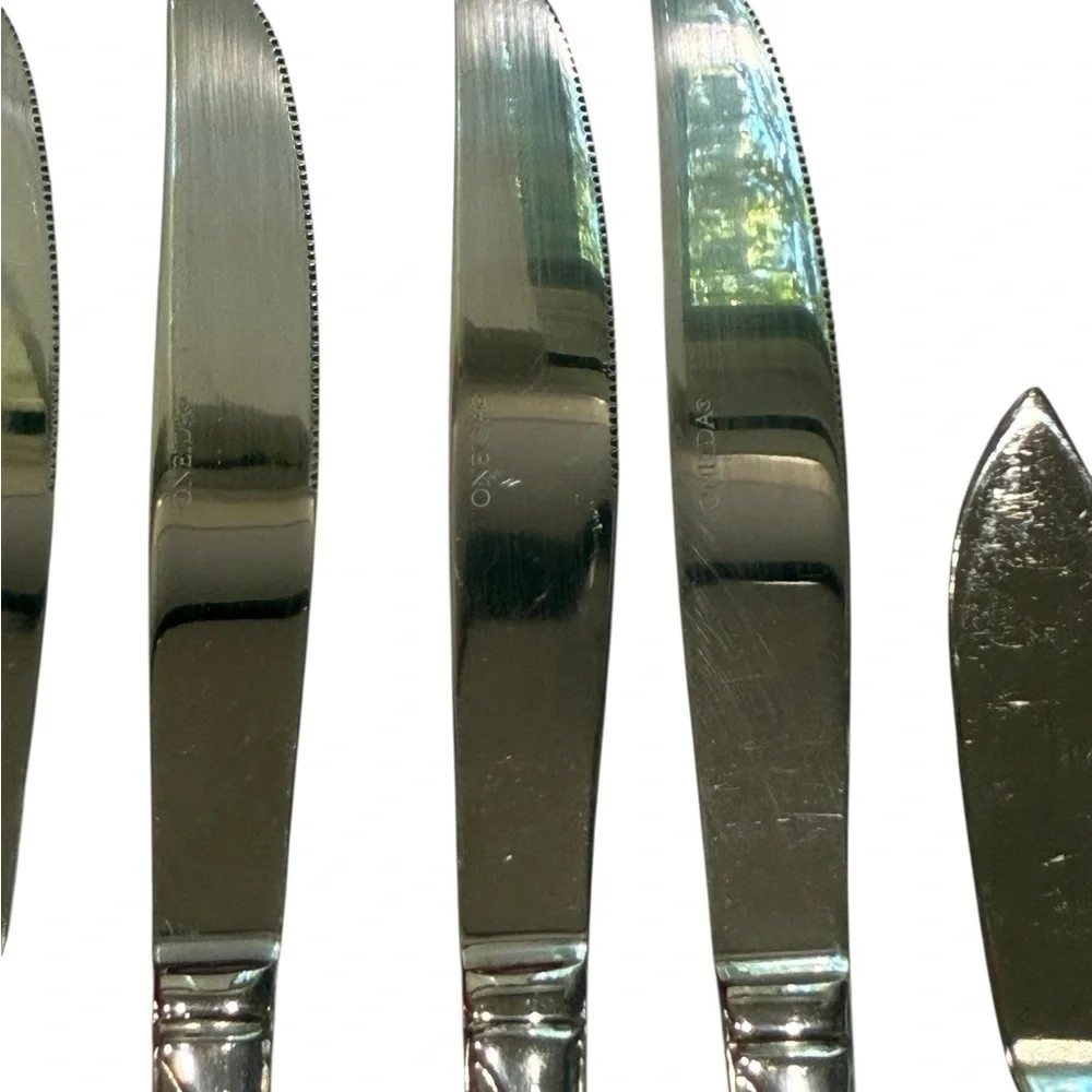 Oneida Flight Reliance 5 Stainless Serrated Dinner Knives and one Butter Knife